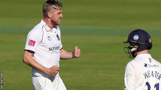 Olly Stone celebrates the wicket of Adam Wheater