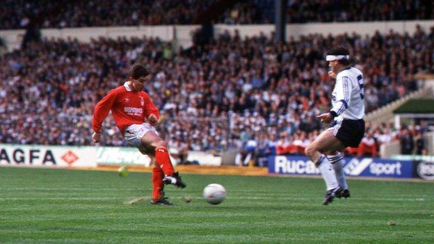 Nigel Clough sweeps the ball past Les Sealey in the Luton Town goal
