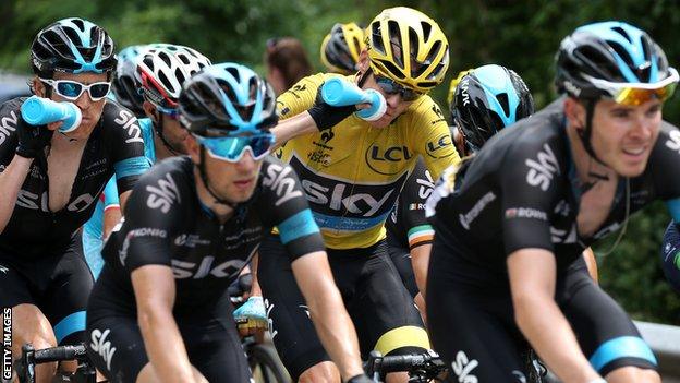 Geraint Thomas (left) and Luke Rowe (right) shepherd Team Sky leader and yellow jersey holder Chris Froome during the 2015 Tour de France