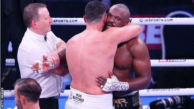 Derek Chisora is hugged by Joseph Parker