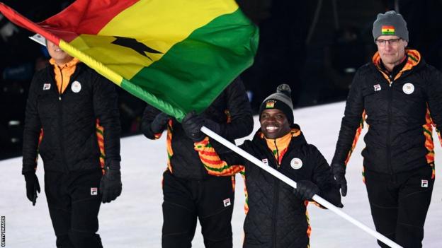 Ghana's flagbearer Akwasi Frimpong leads the delegation as they parade during the opening ceremony