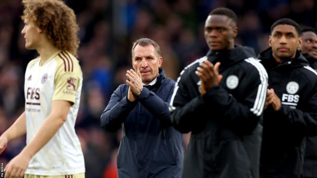 Brendan Rodgers (centre) applauds Leicester City fans