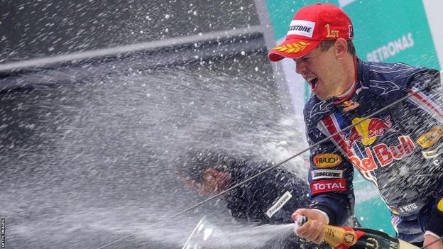 Sebastian Vettel sprays champagne to celebrate winning the 2009 Chinese Grand Prix