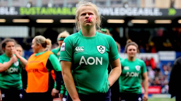 Ireland players look disappointed after the loss to Wales