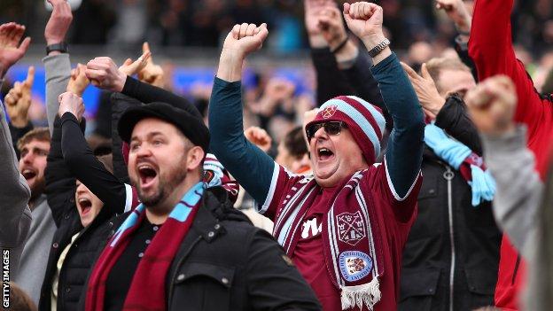 West Ham supporters celebrate at the London Stadium