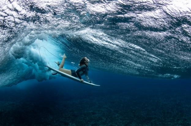 Olivia Ottaway dives under a wave in Teahupo'o, French Polynesia, which will host the surfing event for the Paris 2024 Olympics