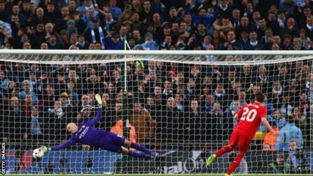 Manchester City keeper Willy Caballero saves Adam Lallana's penalty during the shootout