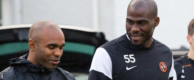Dundee United's Florent Sinama Pongolle and Guy Demel