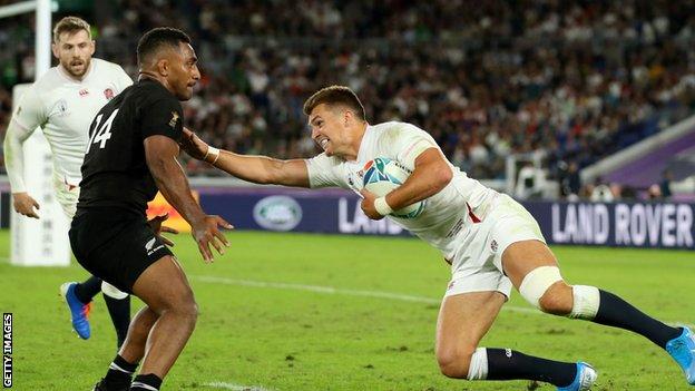 Henry Slade hands off a defender during England's win over New Zealand at the 2019 Rugby World Cup