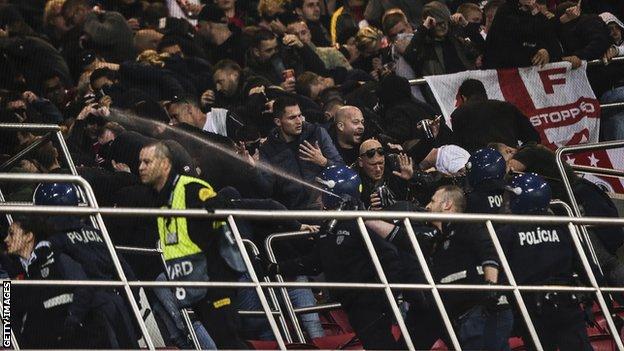 Ajax fans clash with police