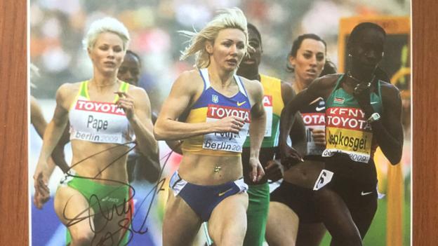 Autographed pictures showing Pape running alongside Caster Semenya in 2009