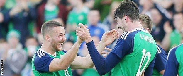 Conor Washington is congratulated by fellow goalscorer Kyle Lafferty at Windsor Park