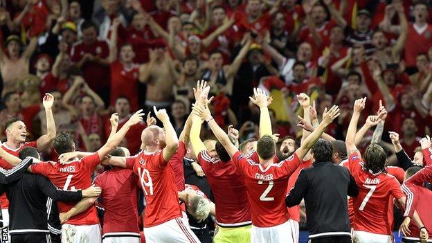 The Welsh players celebrate the Euro 2016 quarter-final win against Belgium in front of their passionate fans