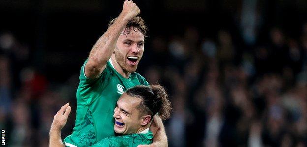 Hugo Keenan and James Lowe at the final whistle of Ireland's win over New Zealand