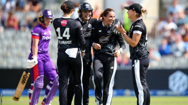 Originals players celebrating the wicket of Georgia Wareham