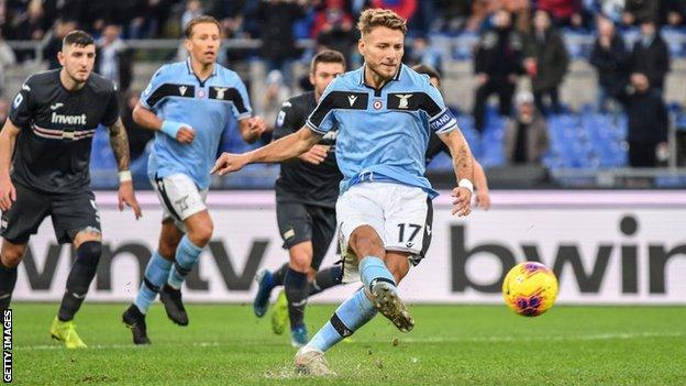 Lazio players cheer after scoring during the Italian Serie A