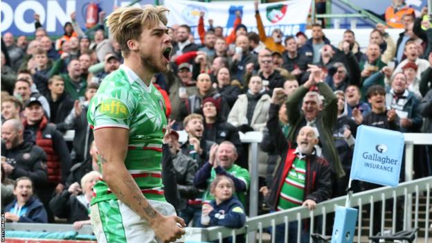 Ollie Hassell-Collins celebrates a try for Leicester