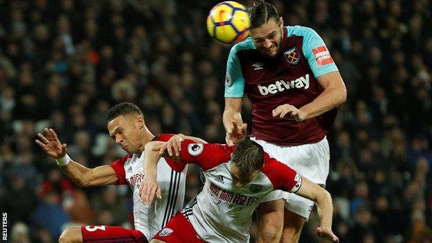 West Ham striker Andy Carroll scores against West Brom