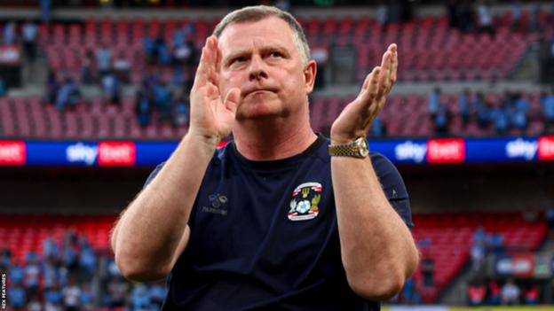Coventry City boss Mark Robins applauds fans after the Sky Blues lose to Luton Town on penalties in the 2023 Championship play-off final