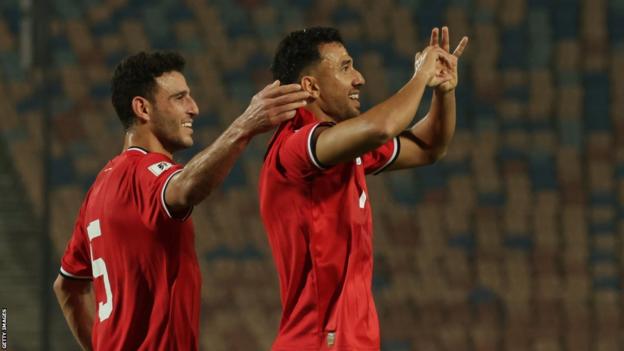 Egypt midfielder Trezeguet (right) celebrates a goal in World Cup qualifying alongside Hamdi Fathi