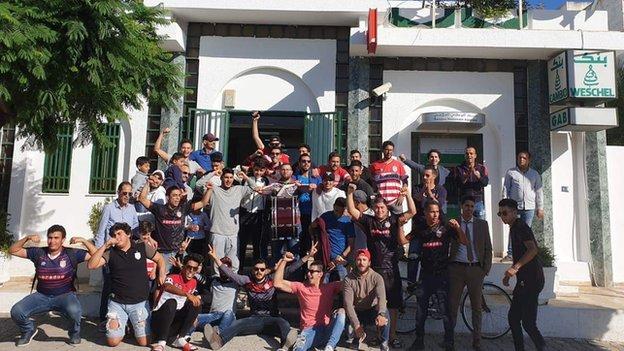 A group of fans after donating to Club Africain