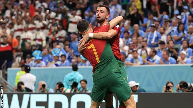 Bruno Fernandes celebrates with Cristiano Ronaldo