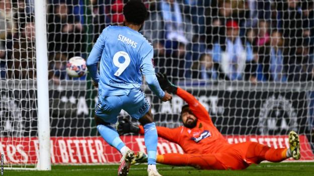 Coventry City's Ellis Sims scores three goals during the Emirates FA Cup fifth round match between Coventry City and Maidstone United at the Coventry Building Society Arena in Coventry, England, on February 26, 2024. Decide on the eyes.