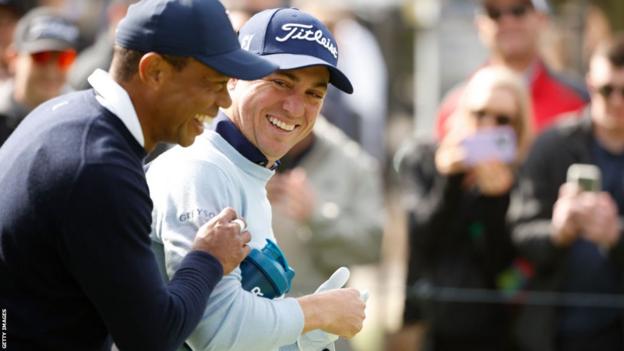 Tiger Woods and Justin Thomas laughing