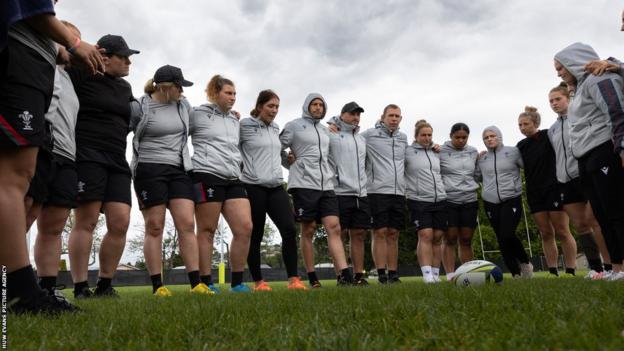 Wales' players and staff huddle together ahead of last year's Rugby World Cup semi-final loss to New Zealand