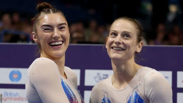 Izzy Songhurst and Bryony Page smile in reaction during the Women's Synchronised Final