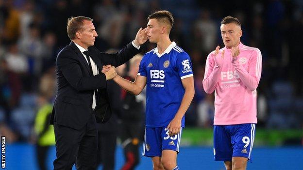 Brendan Rodgers consoles Luke Thomas on the pitch