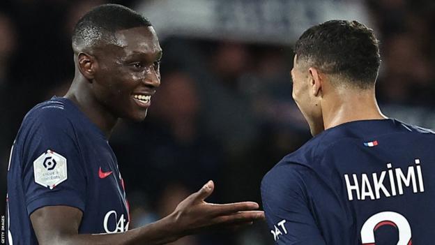 Paris St-Germain players Randal Kolo Muani and Achraf Hakimi