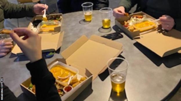 Reading City fans enjoying Chinese food which is on sale at the non-league club