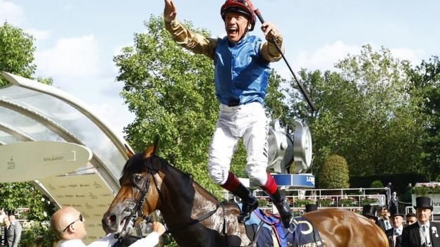 Frankie Dettori celebrates with a flying dismount after winning on Gregory at Royal Ascot