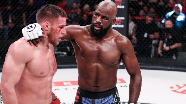 Corey Anderson puts his arm around Vadim Nemkov