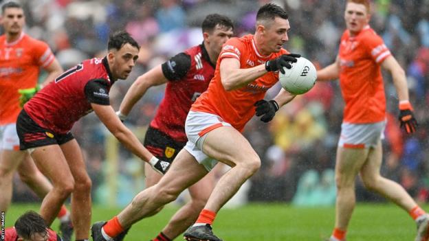 Shane McPartlan bursts straight through the Down defence to score Armagh's second goal