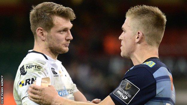 Dan Biggar and Gareth Anscombe shake hands after a match between Ospreys and Cardiff Blues