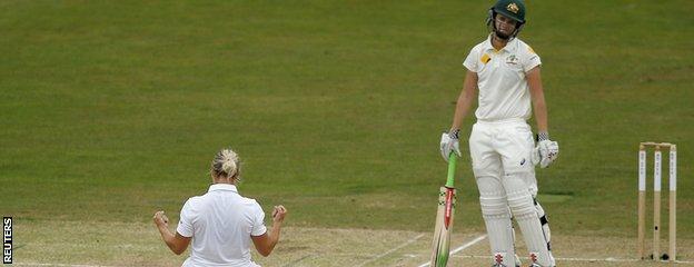 Katherine Brunt celebrates the wicket of a dejected Jess Jonassen