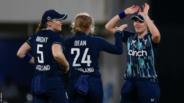 Heather Knight (left), Charlie Dean (middle) and Nat Sciver (right) celebrate a wicket for England v West Indies