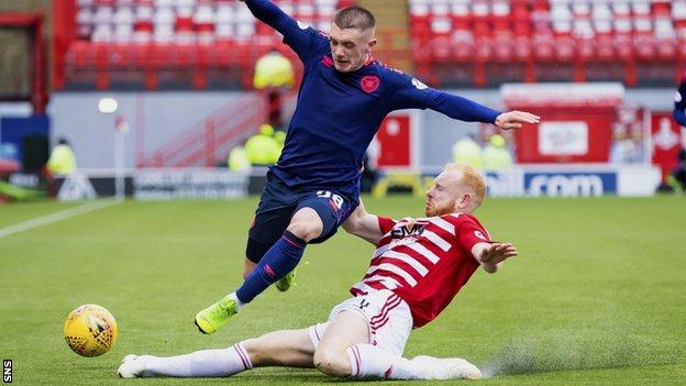 Ziggy Gordon of Hamilton Academical tackles Hearts' Callumn Morrison