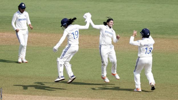 Sneh Rana (middle) celebrates a wicket for India v England