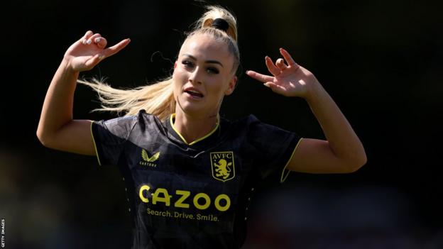 Woman wearing Brazil football soccer shirt Stock Photo by ©AVFC