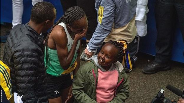 An emotional Hellen Obiri celebrates with her daughter