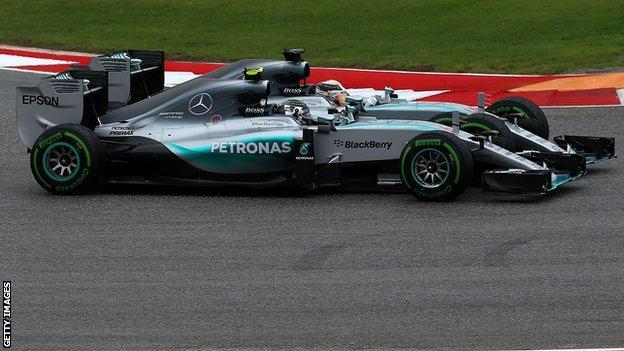 Lewis Hamilton and Nico Rosberg racing side by side