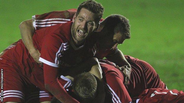 Denbigh Town players celebrate the semi-final win over GAP Connah's Quay