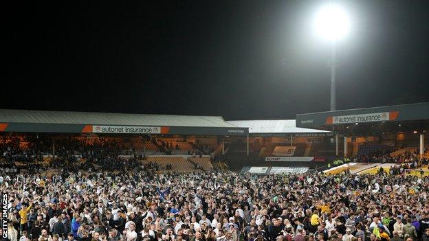 Fans of Port Vale on the pitch after victory in the League Two play-off against Swindon Town