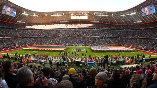 US and German flags on the field before the NFL game in Munich in 2022