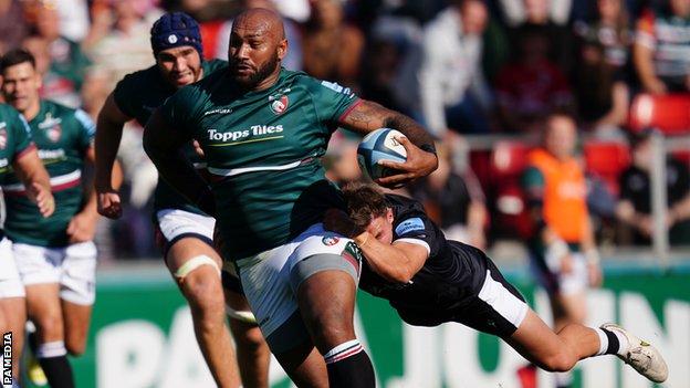 Leicester Tigers' Nemani Nadolo is tackled by Newcastle Falcons' Josh Barton