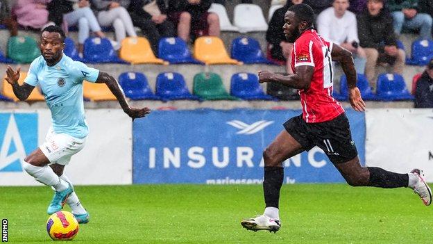 Derry's James Akintunde attempts to outpace Riga's Muzinga Glody Ngond