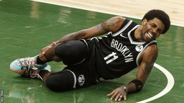 Kyrie Irving in pain after injuring his ankle against the Milwaukee Bucks